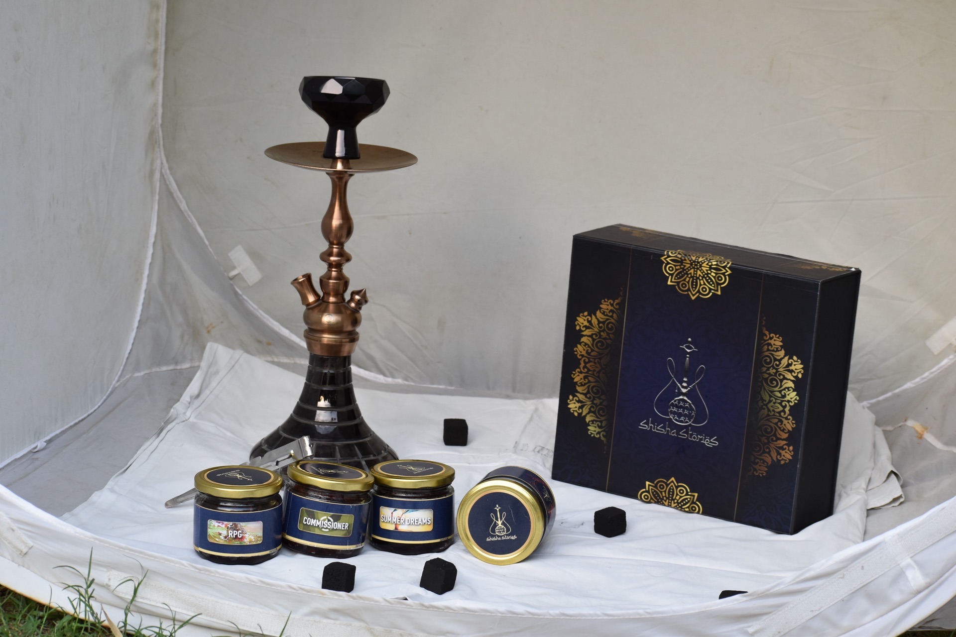 Shisha Stories — gift box and blend jars on the studio set.