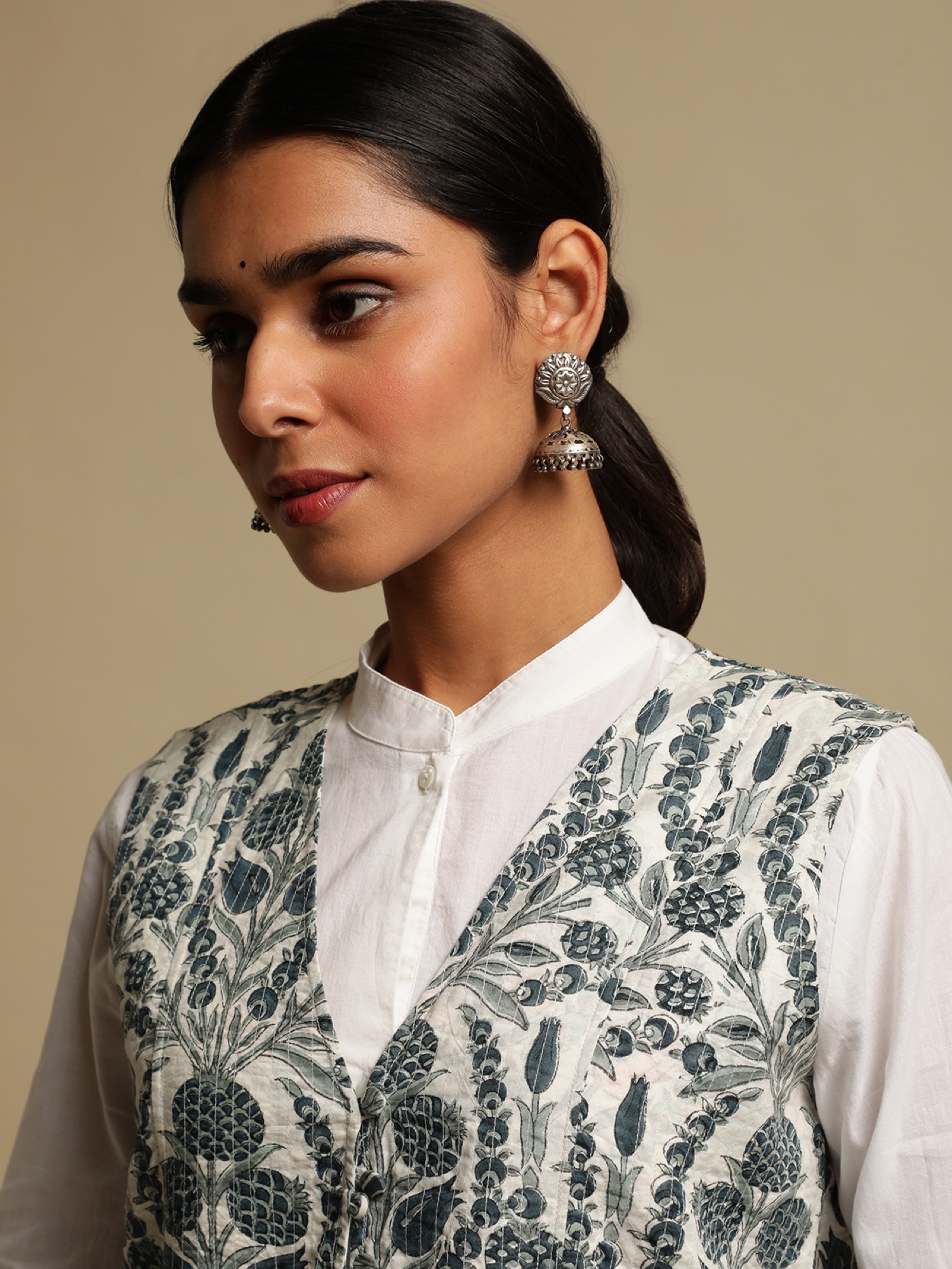 Yumi — Anaar Jacket detail, jaal-print waistcoat against white kurta.